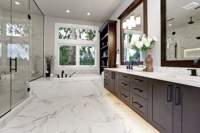 Elegant Bathroom with Backlit Mirrors